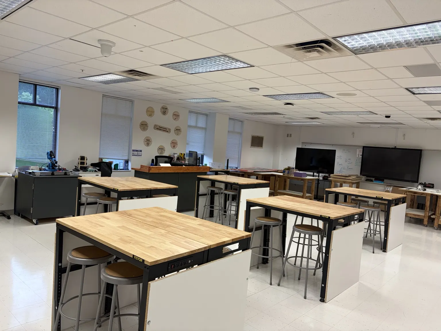 Northside engineering classroom with workbenches, tools, and robotics equipment
